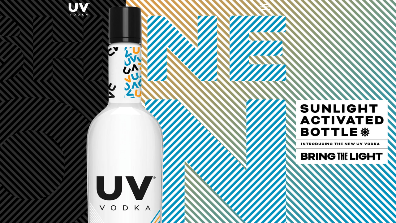 A bottle of uv vodka on a striped background